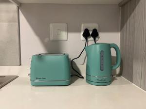 a toaster and a toaster sitting on a counter at Modern Apartment in Centurion in Centurion