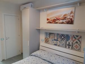 מיטה או מיטות בחדר ב-Scalovecchio