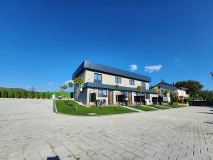a large house with a driveway in front of it at Alexander The Great ATG in Skopje