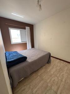 Ένα ή περισσότερα κρεβάτια σε δωμάτιο στο Suíte