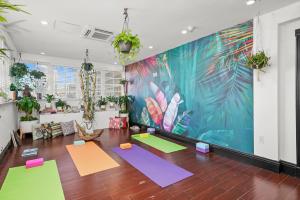 a yoga room with colorful mats on the floor at Hotel Croydon in Miami Beach