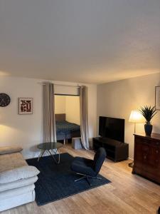 Posezení v ubytování Appartement cosy rez de jardin Kaligone