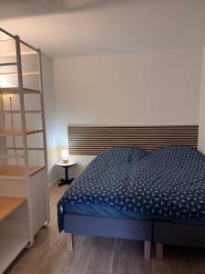 Postel nebo postele na pokoji v ubytování Appartement cosy rez de jardin Kaligone