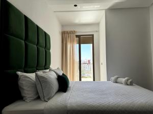 Ένα ή περισσότερα κρεβάτια σε δωμάτιο στο New Comfortable Apartment with Netflix & IPTV