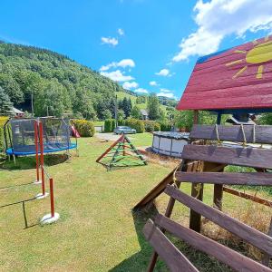 a group of playground equipment in a park at Horská chaloupka Bělá pod Pradědem in Bělá pod Pradědem