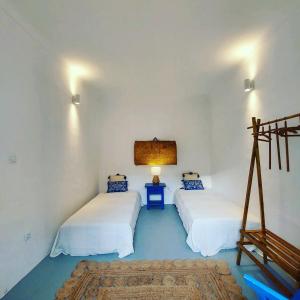 Postel nebo postele na pokoji v ubytování Moradia com Piscina Casa Mourisca Alqueva