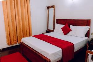 Giường trong phòng chung tại Ocean Glow