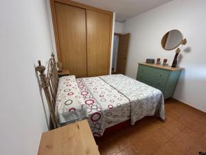 Postel nebo postele na pokoji v ubytování Faro de Mar