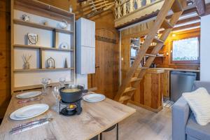 a kitchen and living room in a tiny house at Mazot cozy chalet spirit in Chamonix in Chamonix-Mont-Blanc