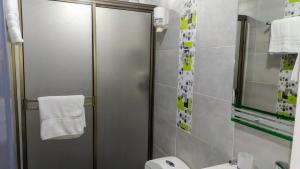 a bathroom with a shower stall and a toilet at Magical house in Salento Wiht prívate jacuzzi in Salento +10 photos