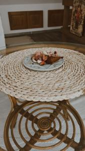a table with a plate of food on top of it at Varázskuckó Apartman in Sümeg