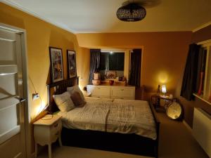 a bedroom with a bed and a window at De Oude Bakkerij in Onderdendam