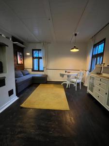 a living room with a couch and a table at Apartment in Pelgulinn in Tallinn