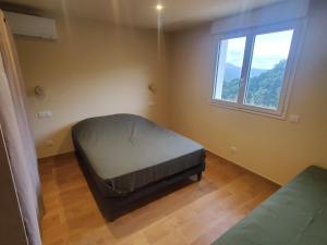 Ένα ή περισσότερα κρεβάτια σε δωμάτιο στο location Appartement Cargèse