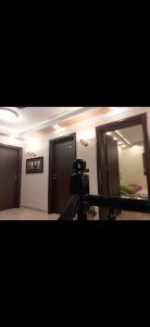 a bathroom with a mirror and a room with a bed at Alibi in Šabac