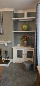 a room with a white shelf with a plant on it at The Park Inn in Stockton-on-Tees