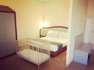 Кровать или кровати в номере Hotel Verdi