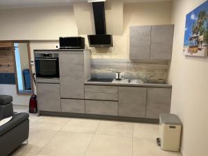 Kuchyň nebo kuchyňský kout v ubytování Apartment P&T