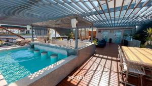 a swimming pool with a sink in a building at Setai Aquamaris by Setai Apartaments in João Pessoa