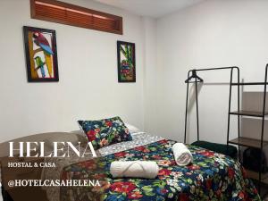 a bedroom with a bed with a colorful comforter at HC Helena in Filandia