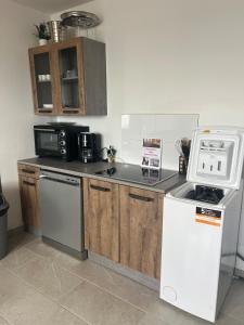 Kuchyň nebo kuchyňský kout v ubytování Appartement vue mer