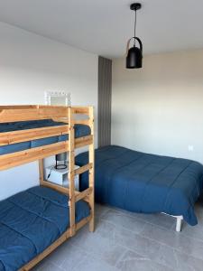 Ένα ή περισσότερα κρεβάτια σε δωμάτιο στο Appartement vue mer