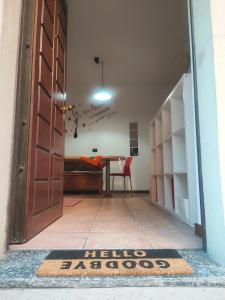 an open door leading to a dining room with a table at Leo House in Trezzo sullʼAdda
