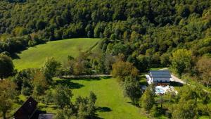 an aerial view of a house in the middle of a field at Villa Peregrine Plitvice Lakes 