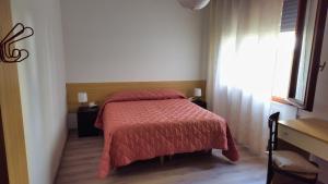 Ένα ή περισσότερα κρεβάτια σε δωμάτιο στο Casa Kendra