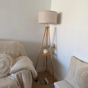 a lamp sitting on a table next to a bed at Piso en el corazon de Las Torres de Cotillas in Las Torres de Cotillas +29 photos