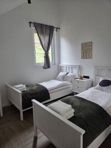 Ένα ή περισσότερα κρεβάτια σε δωμάτιο στο Silver House - Home away from home