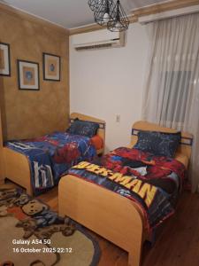 Ένα ή περισσότερα κρεβάτια σε δωμάτιο στο Legacy Lodge Heliopolis