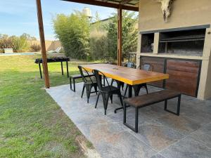 a wooden table and chairs on a patio at Quinta Canning MyP in Canning