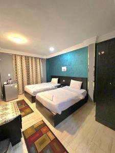 Postel nebo postele na pokoji v ubytování New pyramid inn