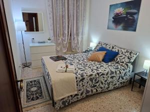 a small bedroom with a bed and a couch at Magnolia Grande in Chieti