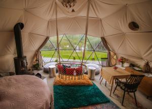 a room with a tent with a table in it at Wonderland in Henfield