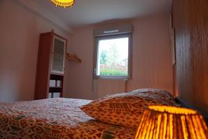 Ένα ή περισσότερα κρεβάτια σε δωμάτιο στο Appartement T2 Morestel, 4 personnes