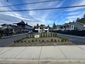 a street with houses and a yard with plants at Brand new fully Private Garden Suite in Delta