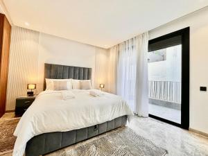 Ένα ή περισσότερα κρεβάτια σε δωμάτιο στο Calm Studio in Oasis, Near Train Station