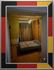 a view of a small room with a bed and a window at Gut & Günstig in Nürnberg +22 photos