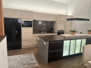 Η κουζίνα ή μικρή κουζίνα στο Leos Suite Appartement