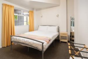 a bedroom with a bed and a window at Portage Bay Hub in Portage