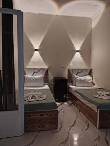 Ένα ή περισσότερα κρεβάτια σε δωμάτιο στο Cairo Season Hotel +16 φωτογραφίες