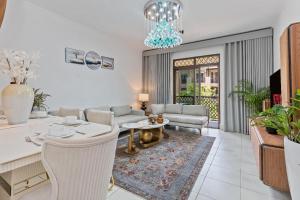 a living room with a couch and a table at Downtown Zaafaran 2, in Dubai
