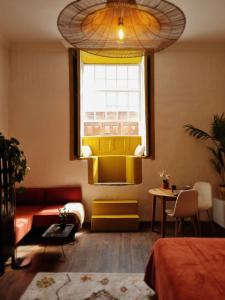 a living room with a couch and a window at OroCasa7 in La Orotava