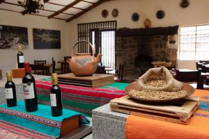 a room with two bottles of wine on a table at Casa Andina Standard Colca in Chivay