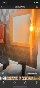 a picture of a bathroom with a toilet and a window at Pousada Studio Siriú Sol Nascente in Garopaba +23 photos