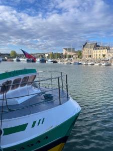 a boat is docked in a body of water at Belle escale by LV in Dieppe
