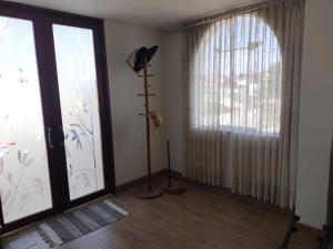 a room with a large glass door and a window at Apartamento in Arequipa