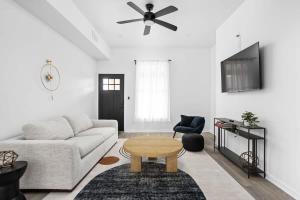 a living room with a couch and a table at Full Duplex Retreat-Two Homes Near Eastside- Family Friendly in Indianapolis